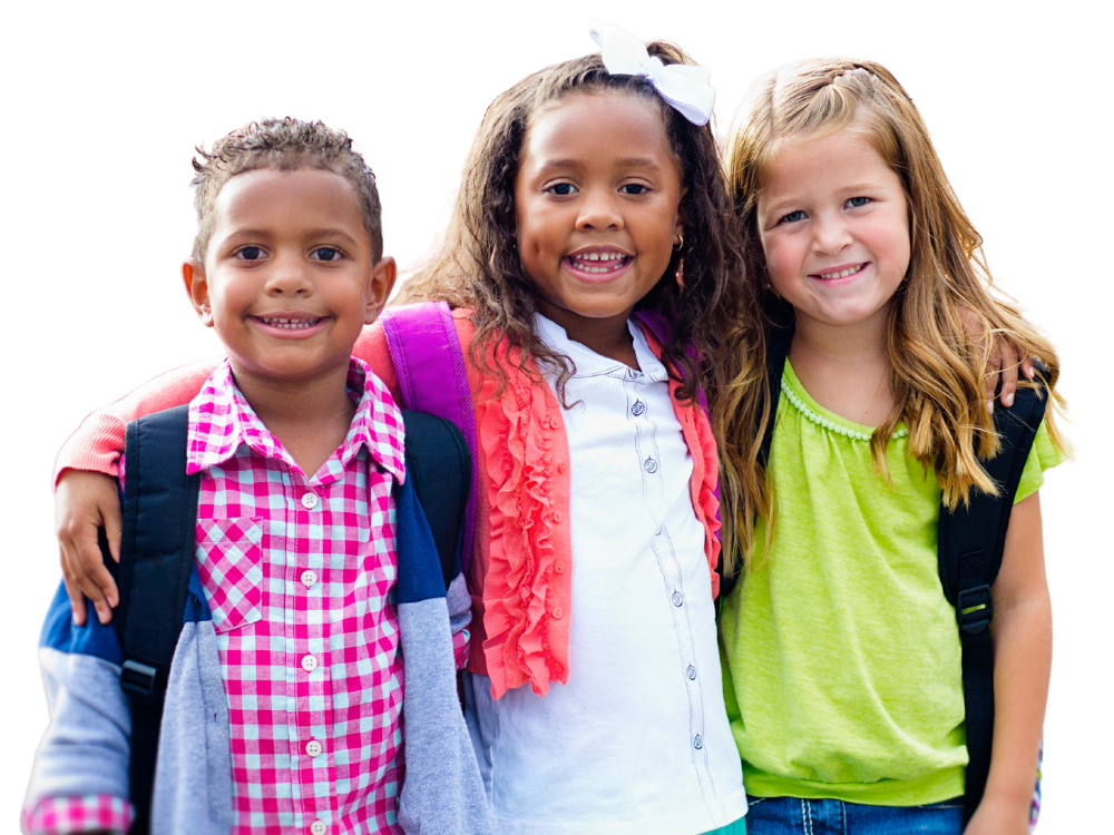 Three children, all smiling and standing together, each with a backpack, looking cheerful.