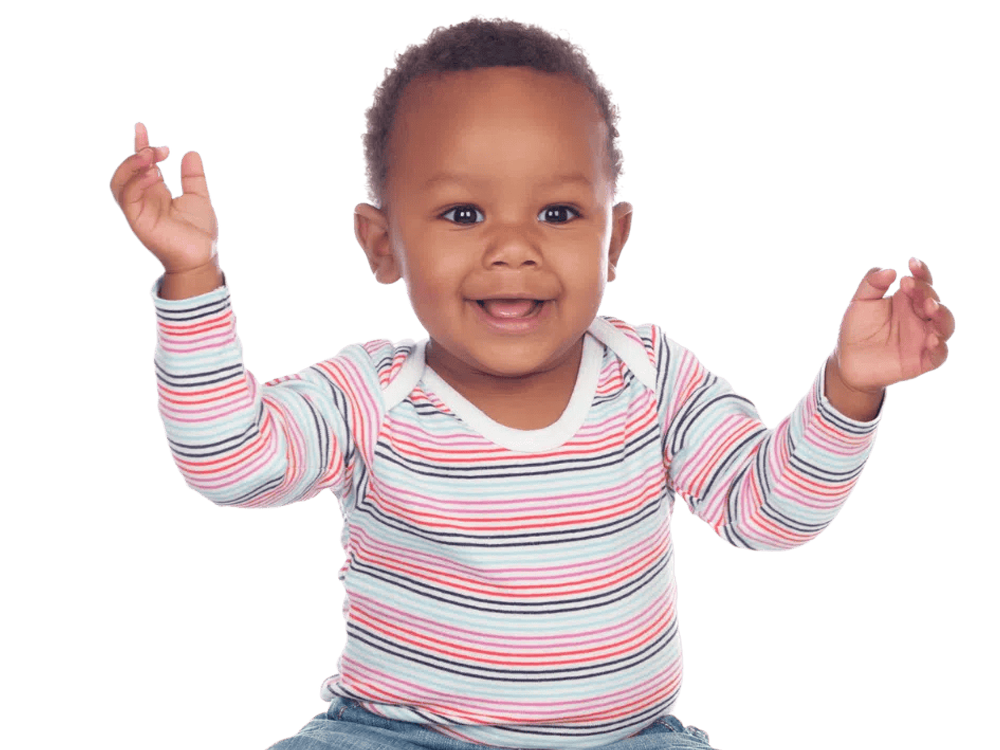 A smiling toddler with raised arms, wearing a striped shirt.
